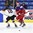 PLYMOUTH, MICHIGAN - APRIL 4: Russia's Iya Gavrilova #8 jumps past Germany's Bernadette Karpf #18 while chasing down a loose puck during quarterfinal round action at the 2017 IIHF Ice Hockey Women's World Championship. (Photo by Matt Zambonin/HHOF-IIHF Images)

